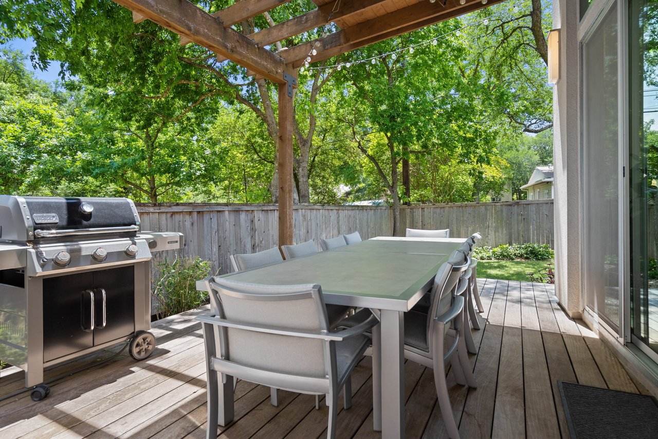 Outdoor grill and dining area on the covered deck at 34 Margranita Crescent, Tarrytown, Austin, TX.