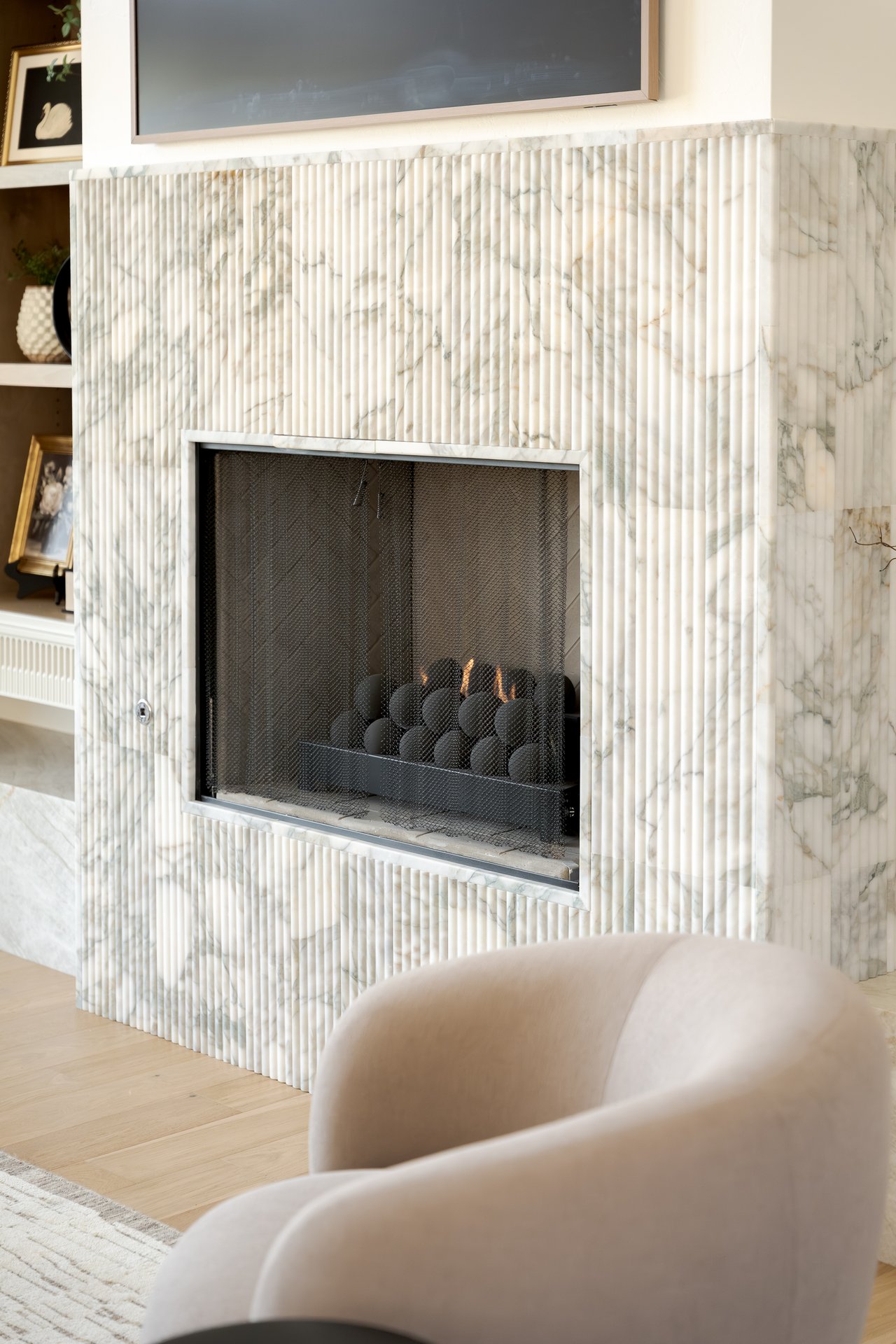 Close-up of cozy seasonal décor and fireplace detail in an Oklahoma City luxury home — showcasing warmth and lifestyle appeal during fall and winter.