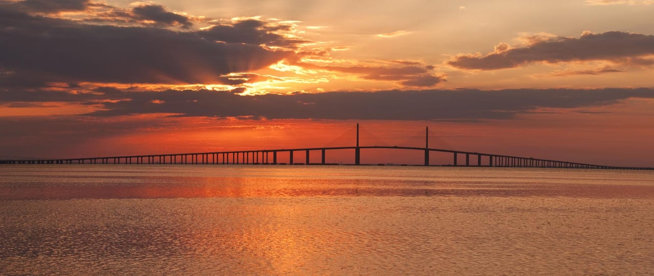 Scenic Florida Gulf Coast highway overlooking the water during sunrise, inspiring a weekend road trip