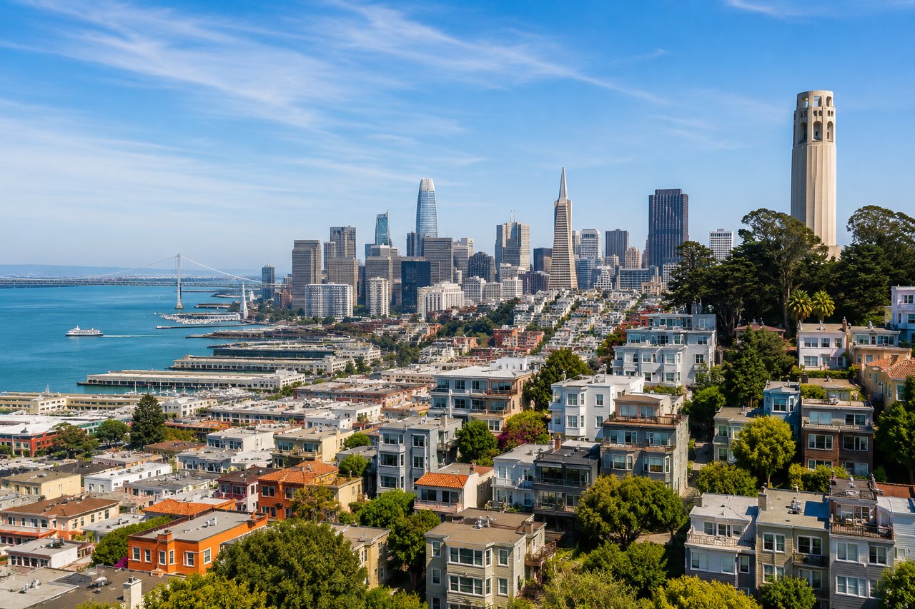 San Francisco luxury homes overlooking the Bay, downtown skyline, and Coit Tower on a clear day.