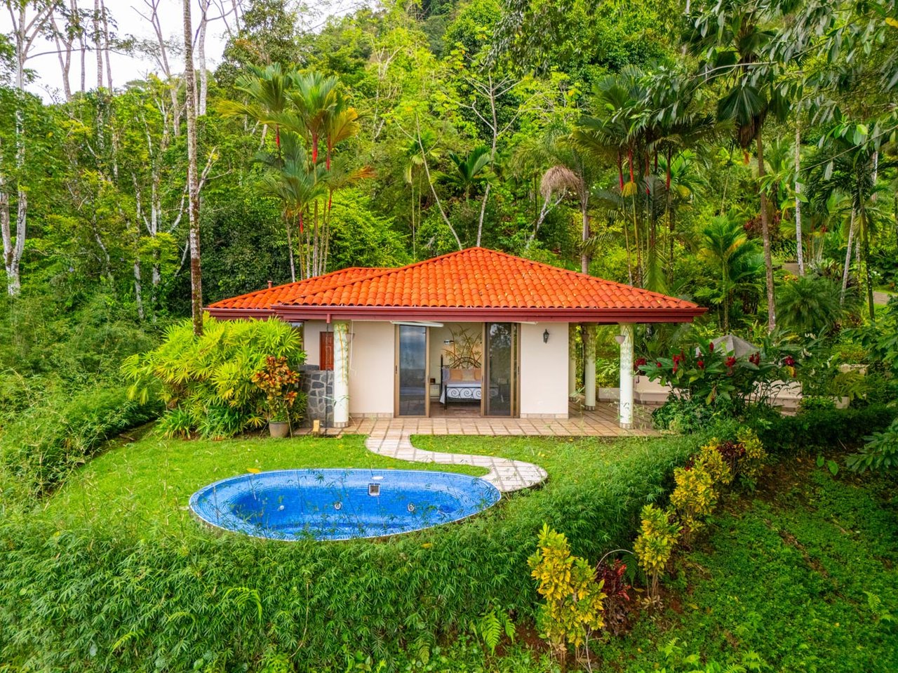 Ocean, jungle & mountain views on a meticulously landscaped 3-home family compound