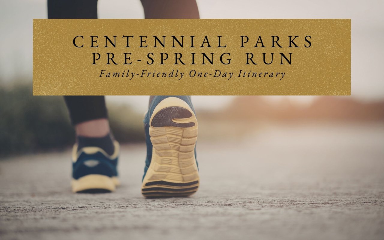 Runner on a paved trail in Centennial, Colorado with leafless trees and mountain views on a cool early spring morning.