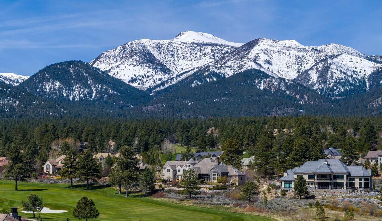 A panoramic view of 89511 showing open mountain views and custom homes