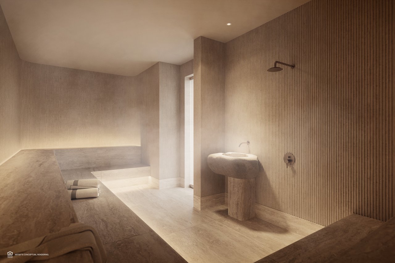 Minimalist bathroom with a stone soaking tub, sculptural basin, and ribbed walls.