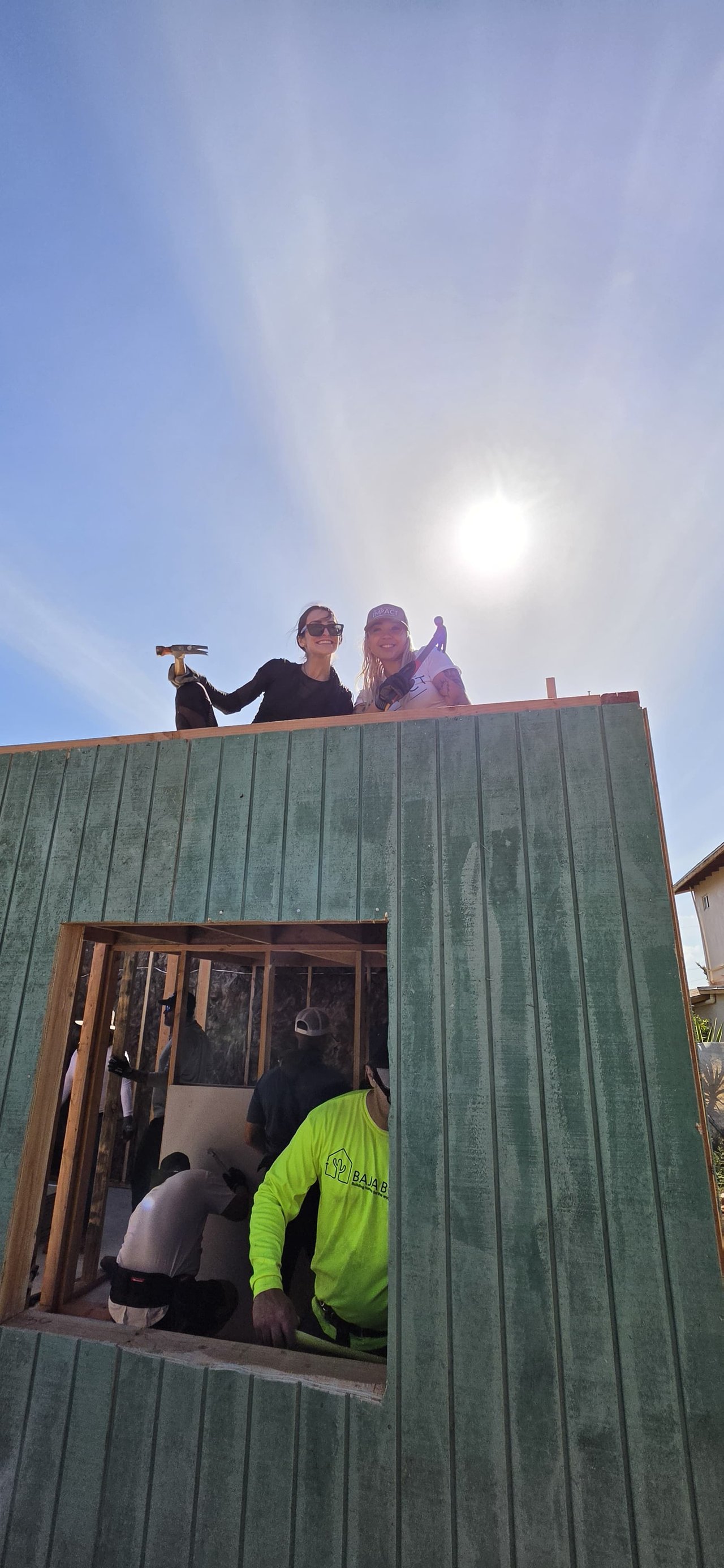 Jade and Kianna securing the roof header on Day One.