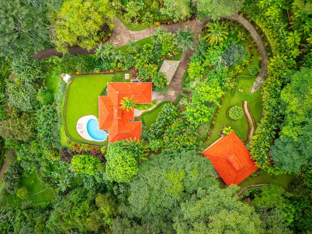 Ocean, jungle & mountain views on a meticulously landscaped 3-home family compound