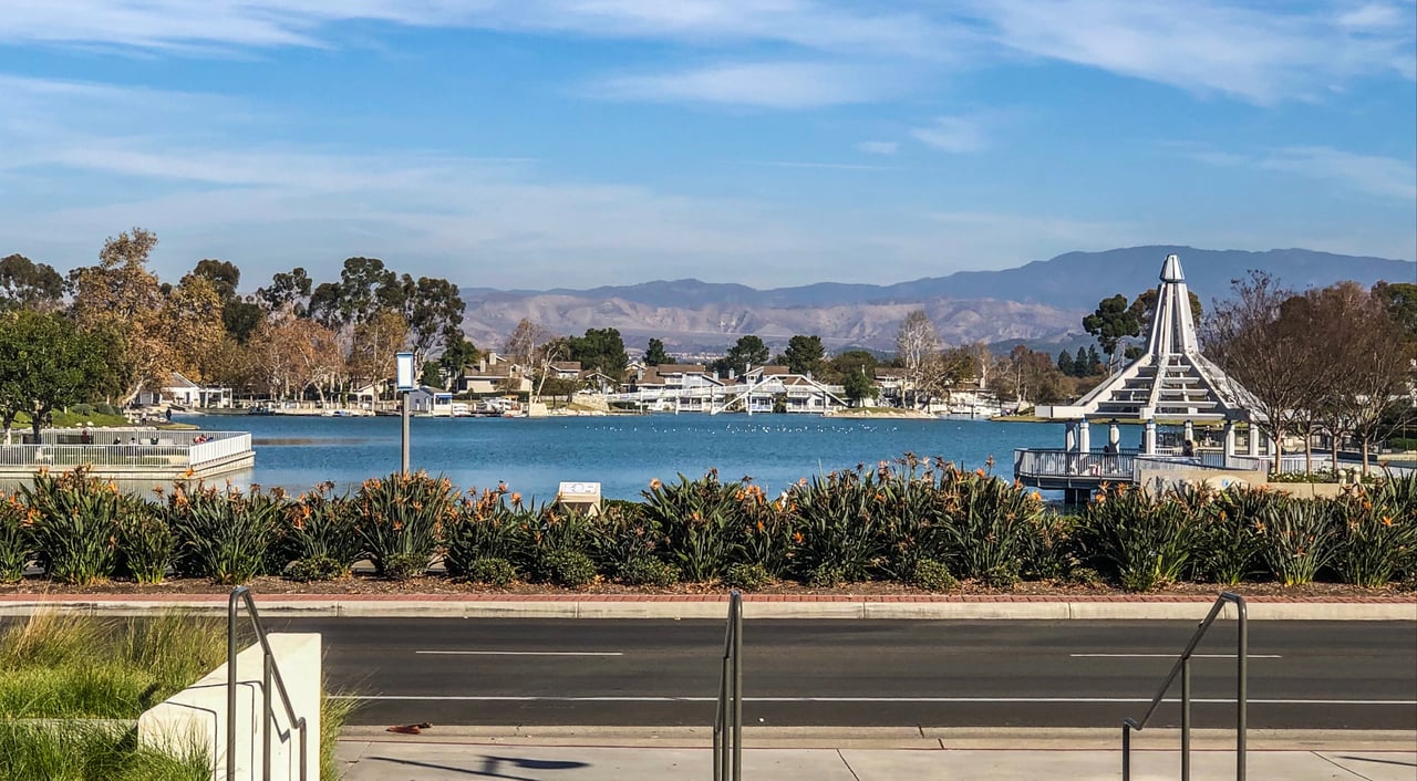 The man-made Woodbridge North Lake with Gazebo in the foreground & Mountains in the back