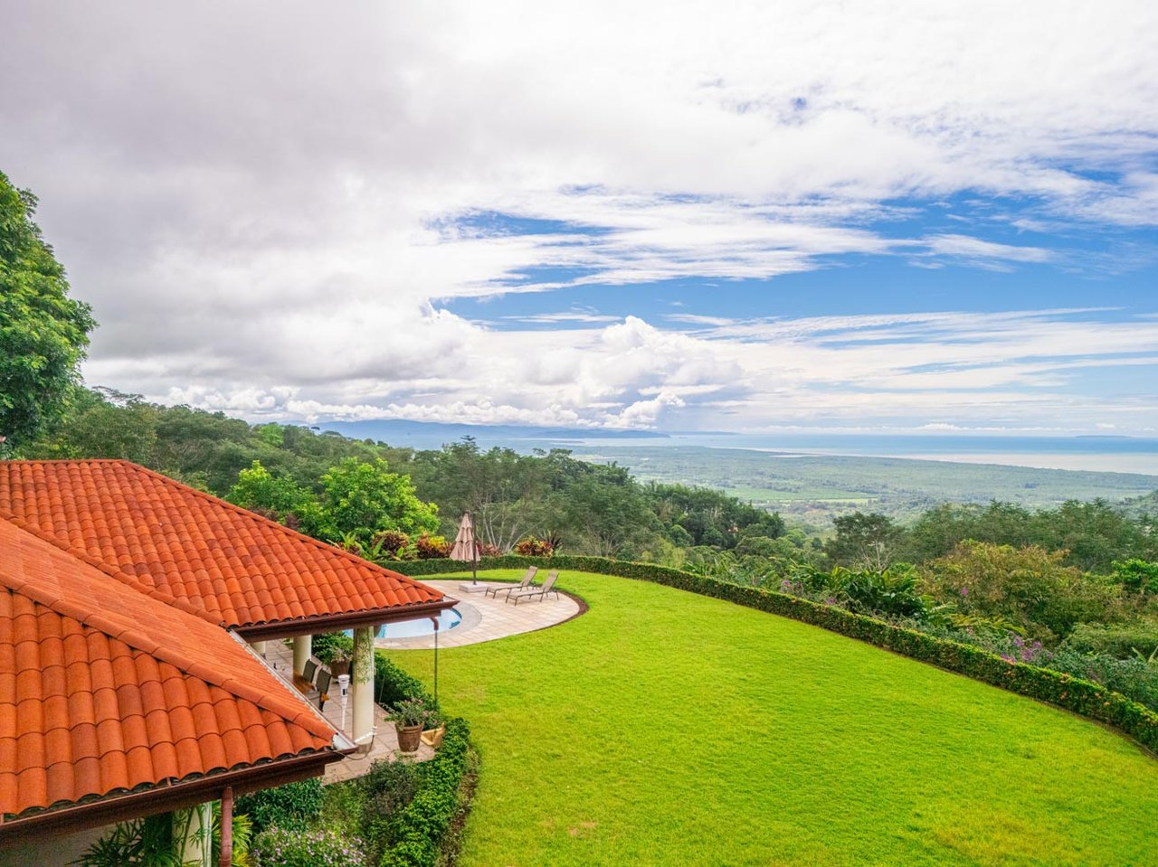 Ocean, jungle & mountain views on a meticulously landscaped 3-home family compound