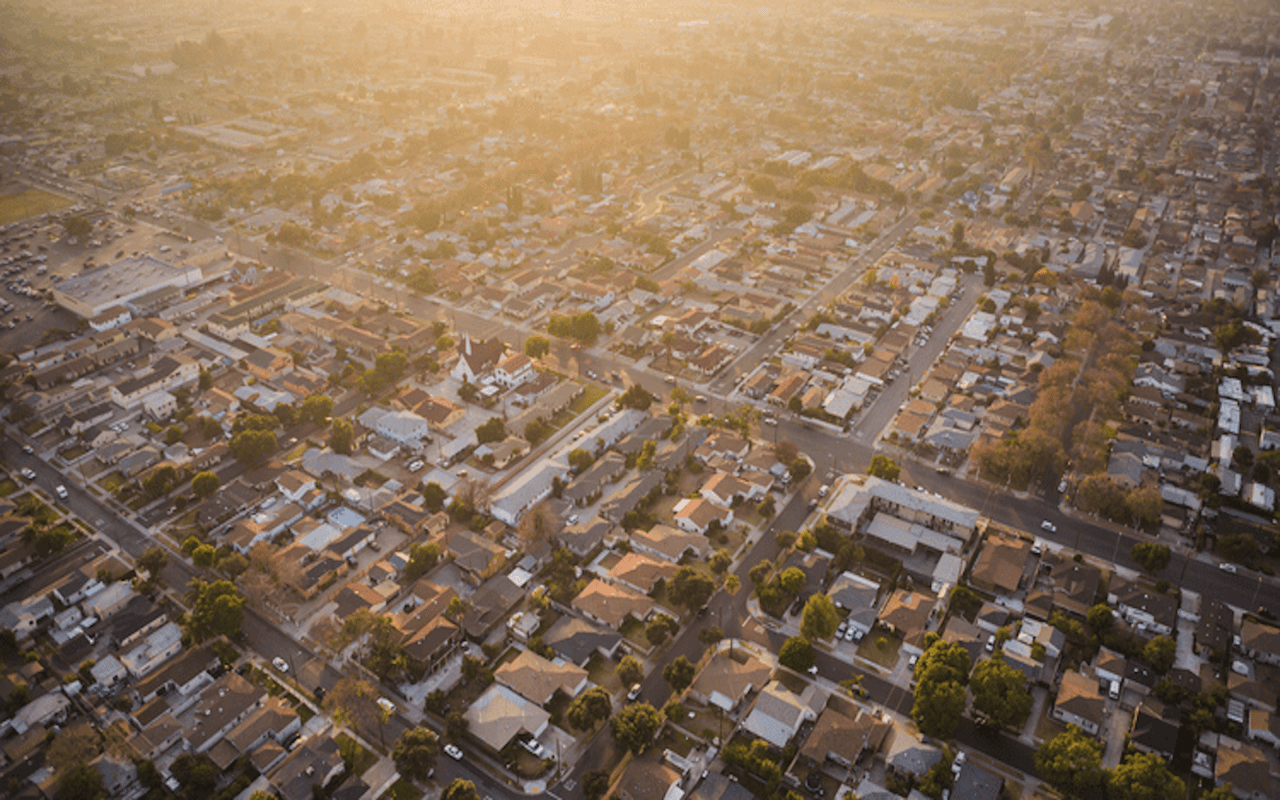 Aerial view of a residential neighborhood with houses and streets.