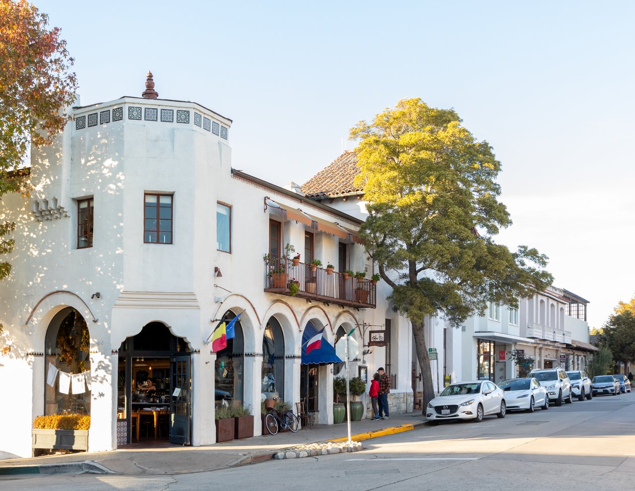 Downtown Carmel-by-the-Sea featuring historic Spanish-style buildings, boutique storefronts, and walkable streets—showcasing the charm and character that drive local real estate demand.