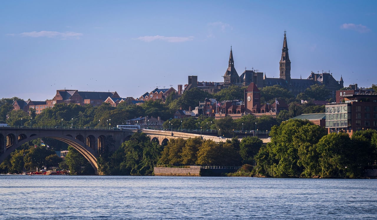 Georgetown University’s towers rise above the Potomac River and Key Bridge.