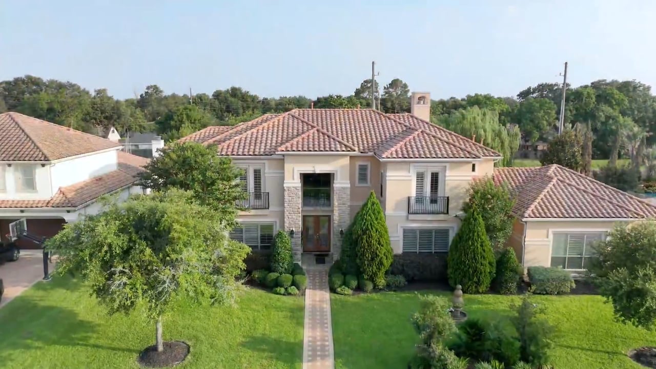Exquisite Luxury Living on an Oversized Lot in Lakes of Parkway
