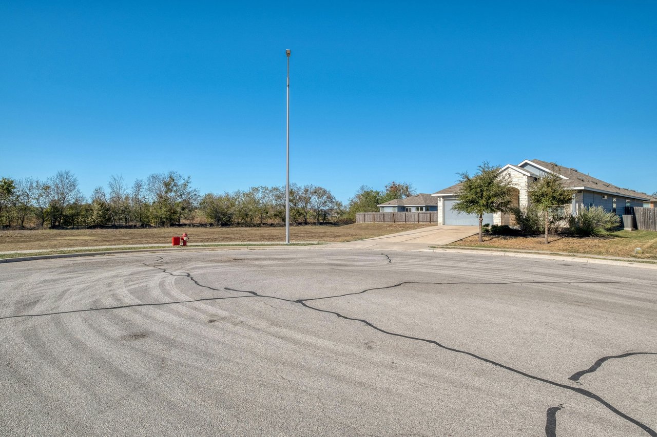 Rare Cul-de-Sac Gem in Manor – With No Neighbor on One Side and Access to HOA-owned Greenspace Right Outside Your Doorstep!