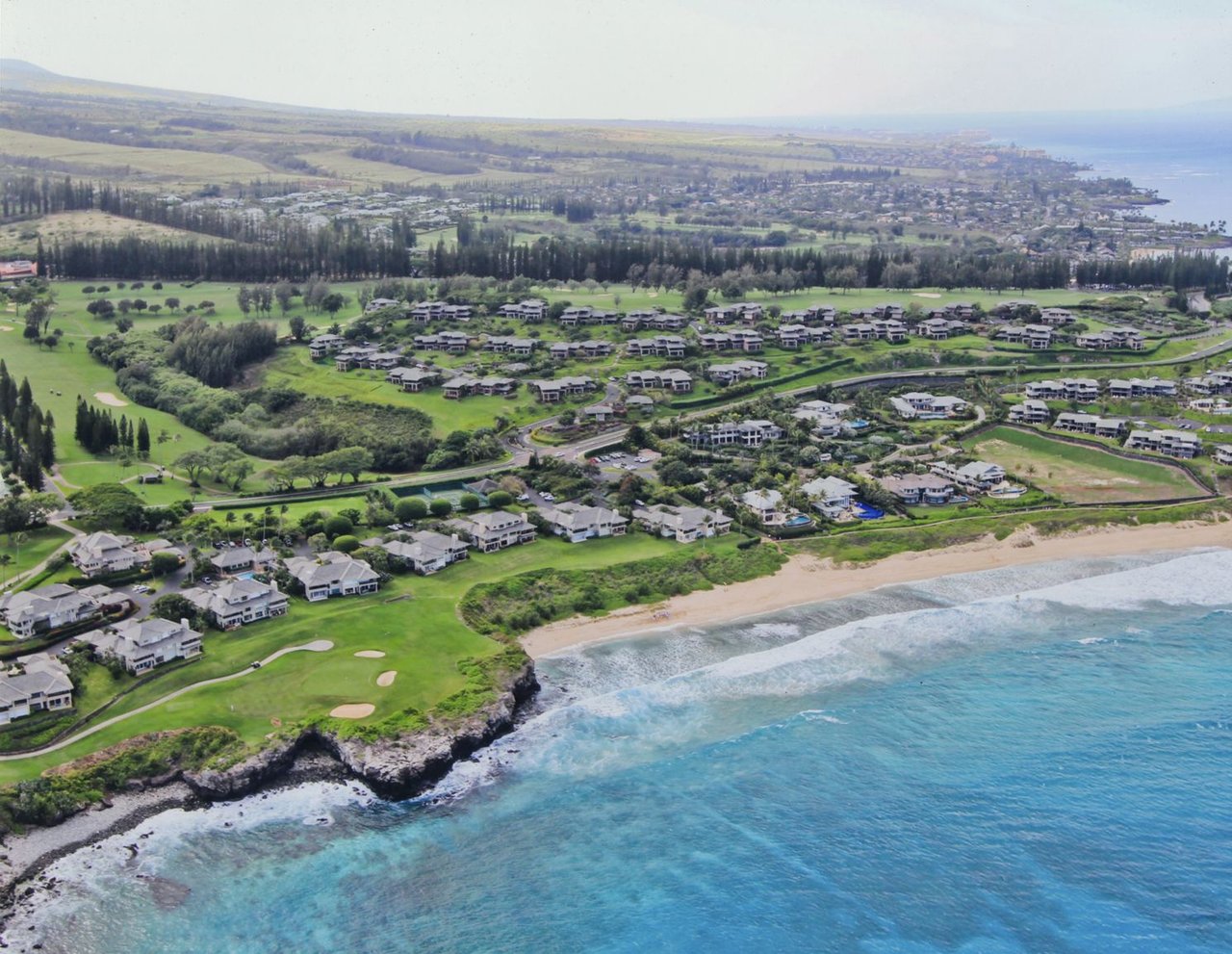 Aerial view of Kapalua and Ironwoods with Bay golf course in foreground