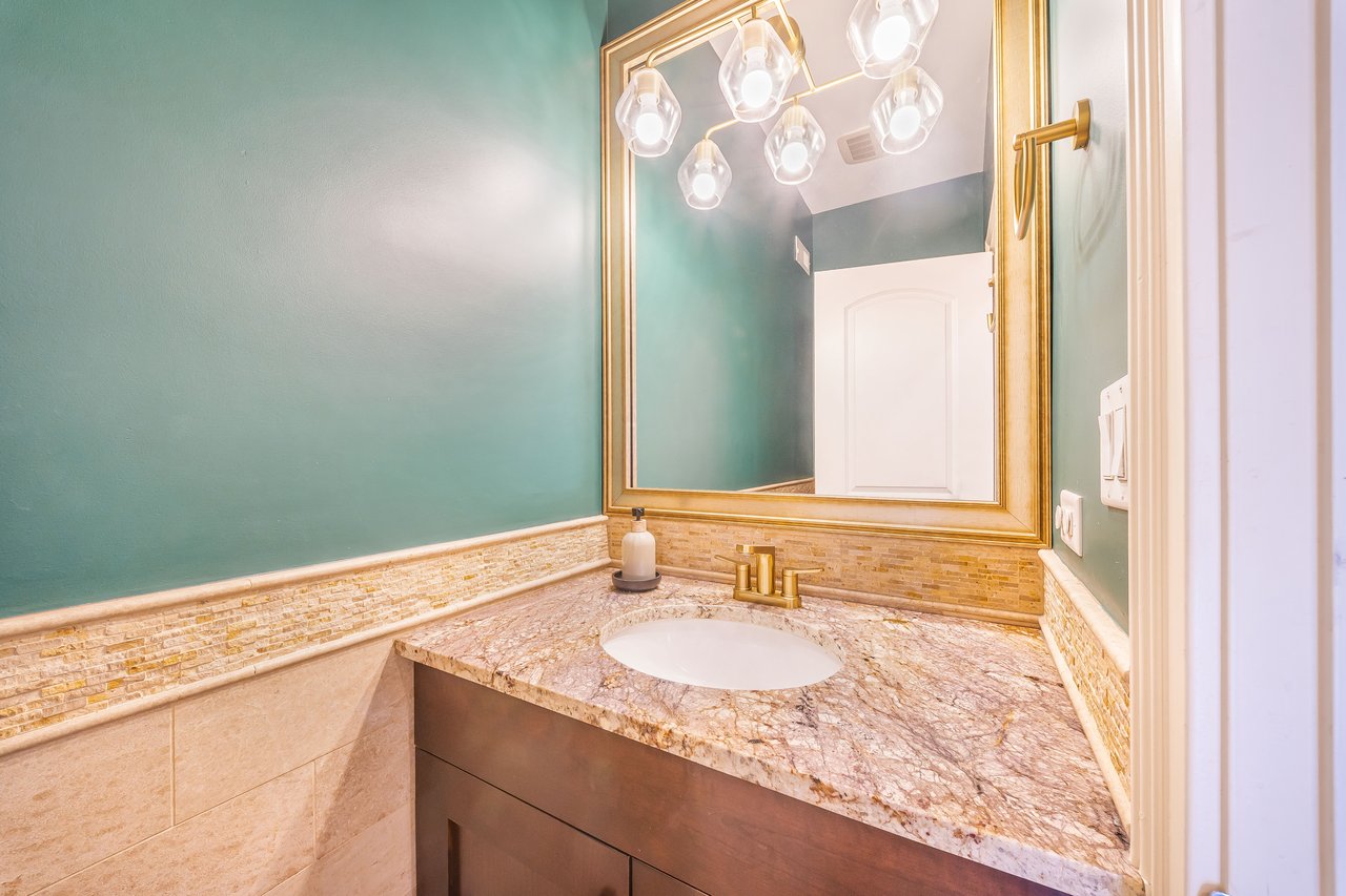 Main-floor powder room with granite vanity