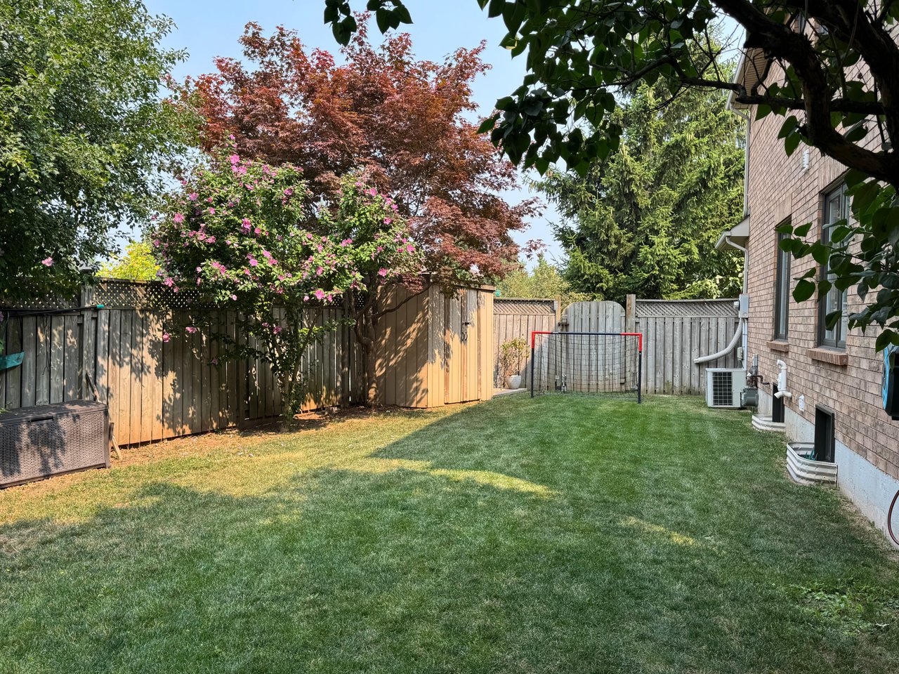 Sun-Filled Sophistication on a Rare Pie-Shaped Lot in West Oak Trails