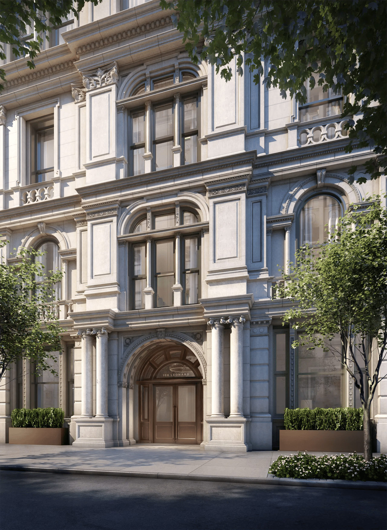 108 Leonard’s ornate stone facade, with a columned arched entrance and tall windows.
