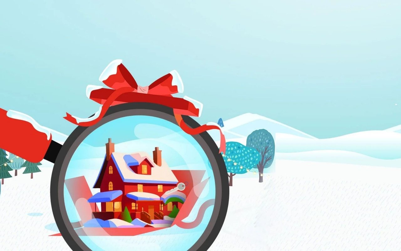 Snow-covered red house viewed through a magnifying glass in a wintry landscape.