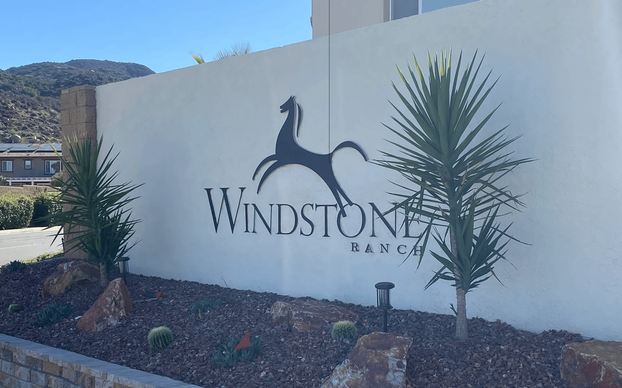 Stone monument sign marking the entrance to the Windstone Ranch community in Wildomar, CA.