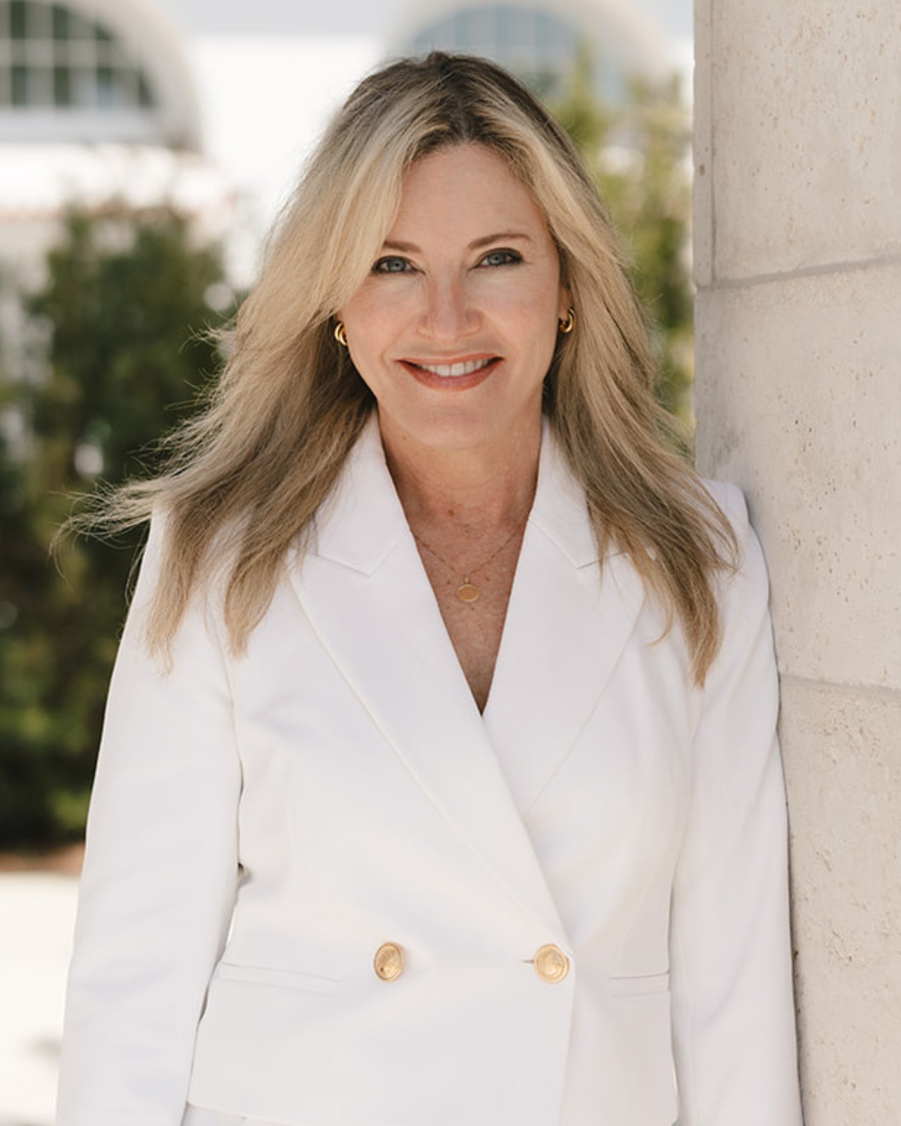 Ginger Harrell, real estate advisor with The Kendall Hood Collection, in professional portrait