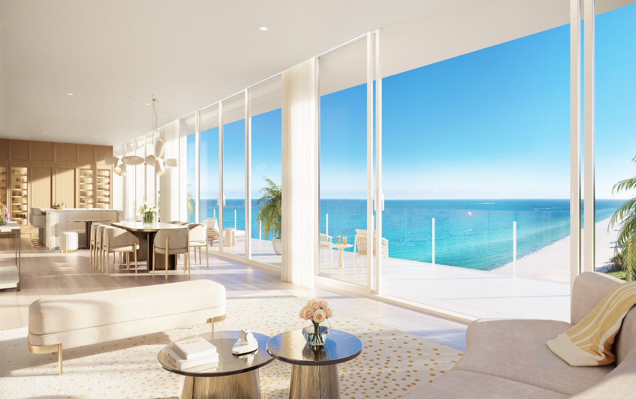 Luxury living and dining area at The Ritz-Carlton Residences, South Beach with floor-to-ceiling glass, ocean views, and expansive terrace access.