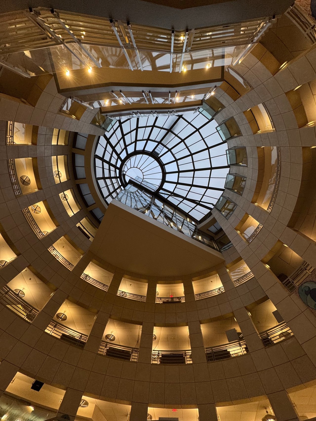 Circular glass skylight atrium with spiral balconies inside San Francisco library
