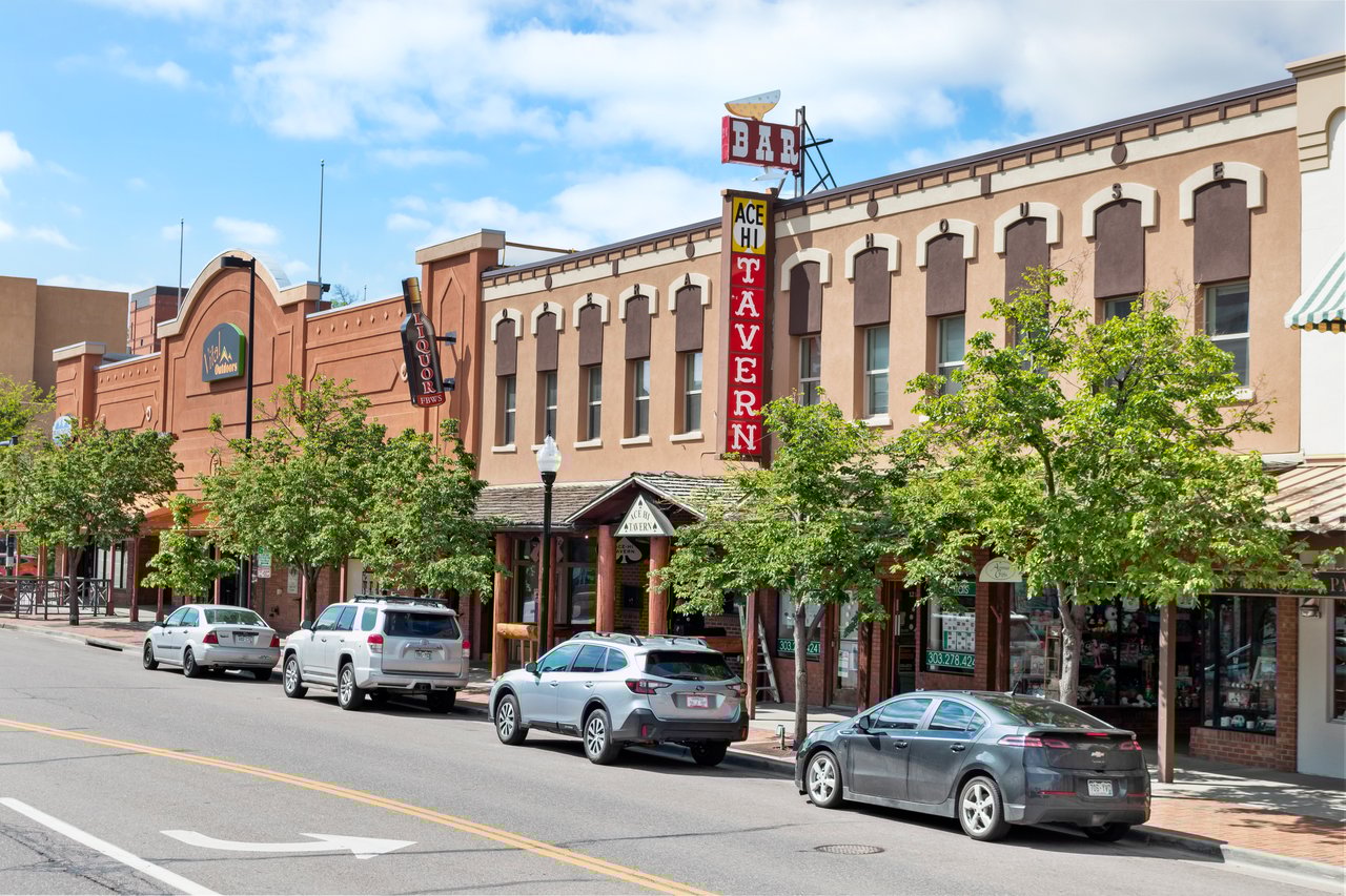 Downtown street view in Golden, Colorado featuring local businesses and a walkable neighborhood atmosphere.