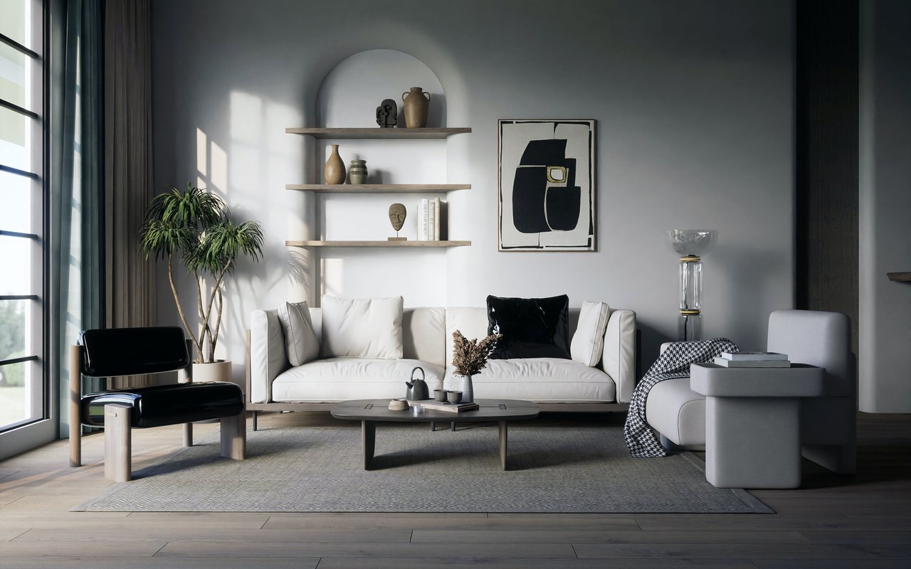 Contemporary living room with a white sofa, black lounge chair, and tall sunlit windows.