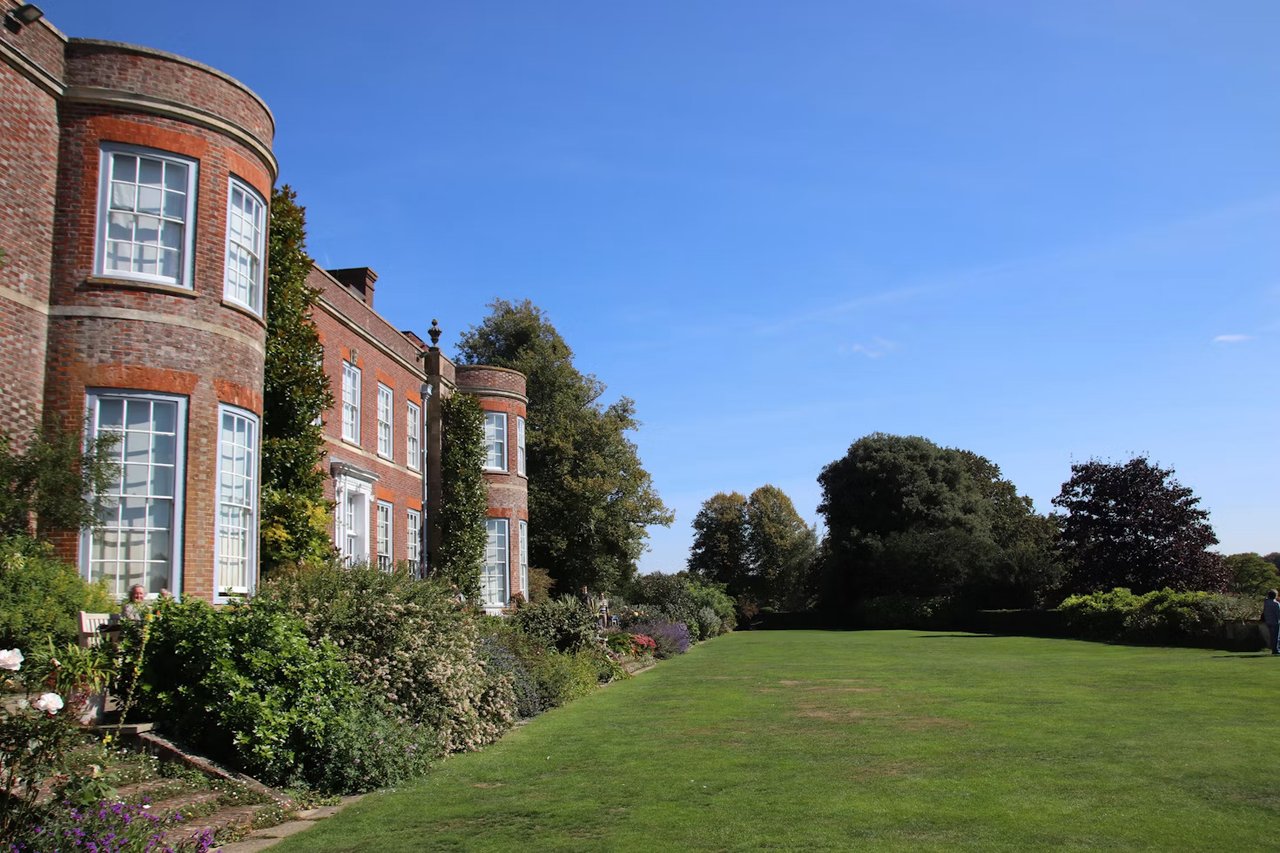 Luxury estate property with expansive landscaped gardens and grounds