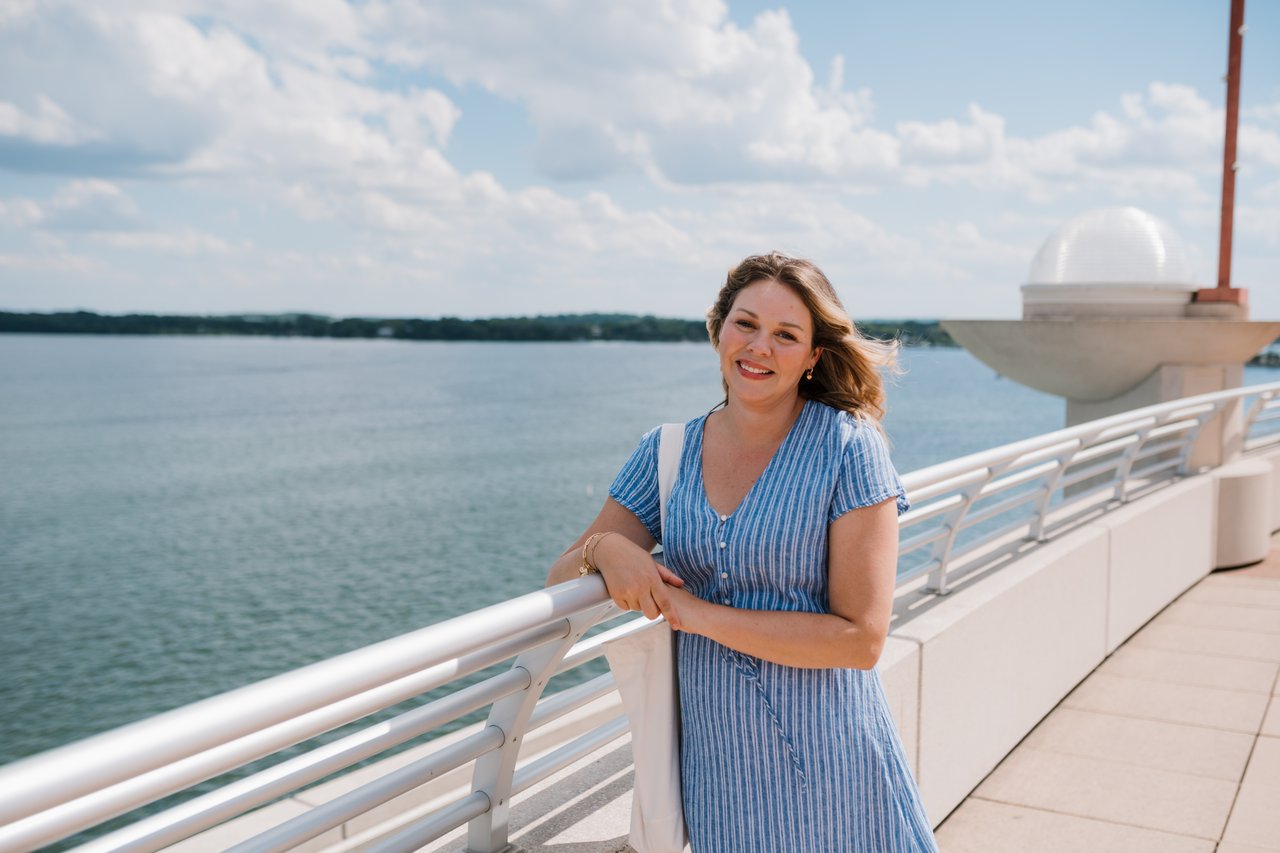 Local Madison real estate advisor Cait Berry enjoying the summer lake views from the Monona Terrace overlooking Lake Monona.