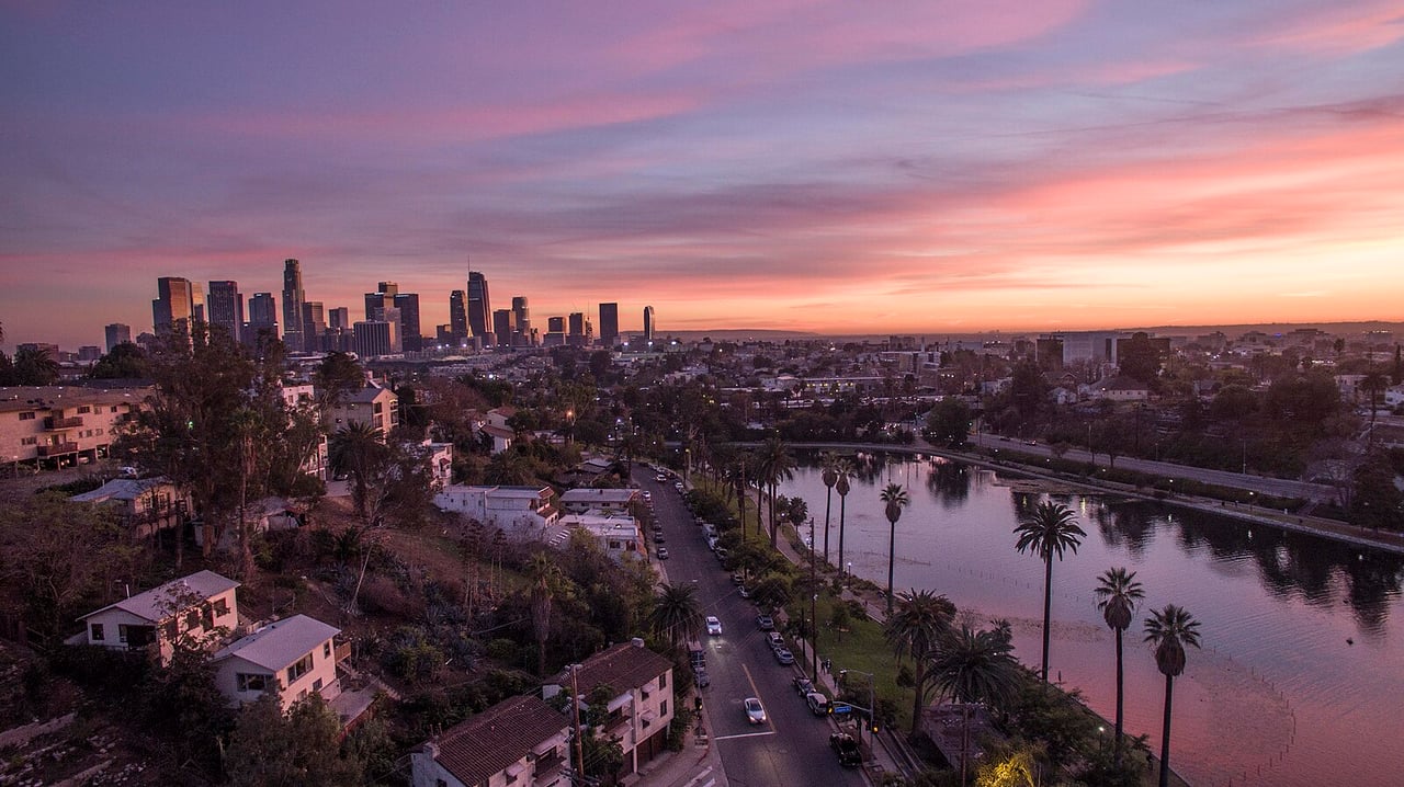 Silver Lake Reservoir in Los Angeles with surrounding hills and modern hillside homes, a defining landmark of Silver Lake.