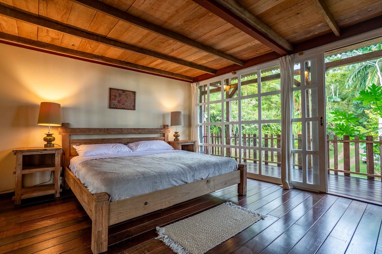 A Handcrafted Residence Immersed in Nature Above the Canopy Ocean View Architectural Home