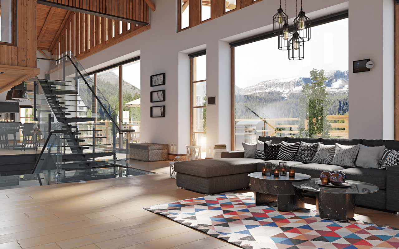 Modern living room with a glass staircase and mountain views through tall windows