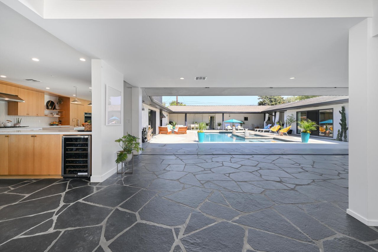 Modern Park Estates home with open indoor outdoor living, pool courtyard, and kitchen in Long Beach California