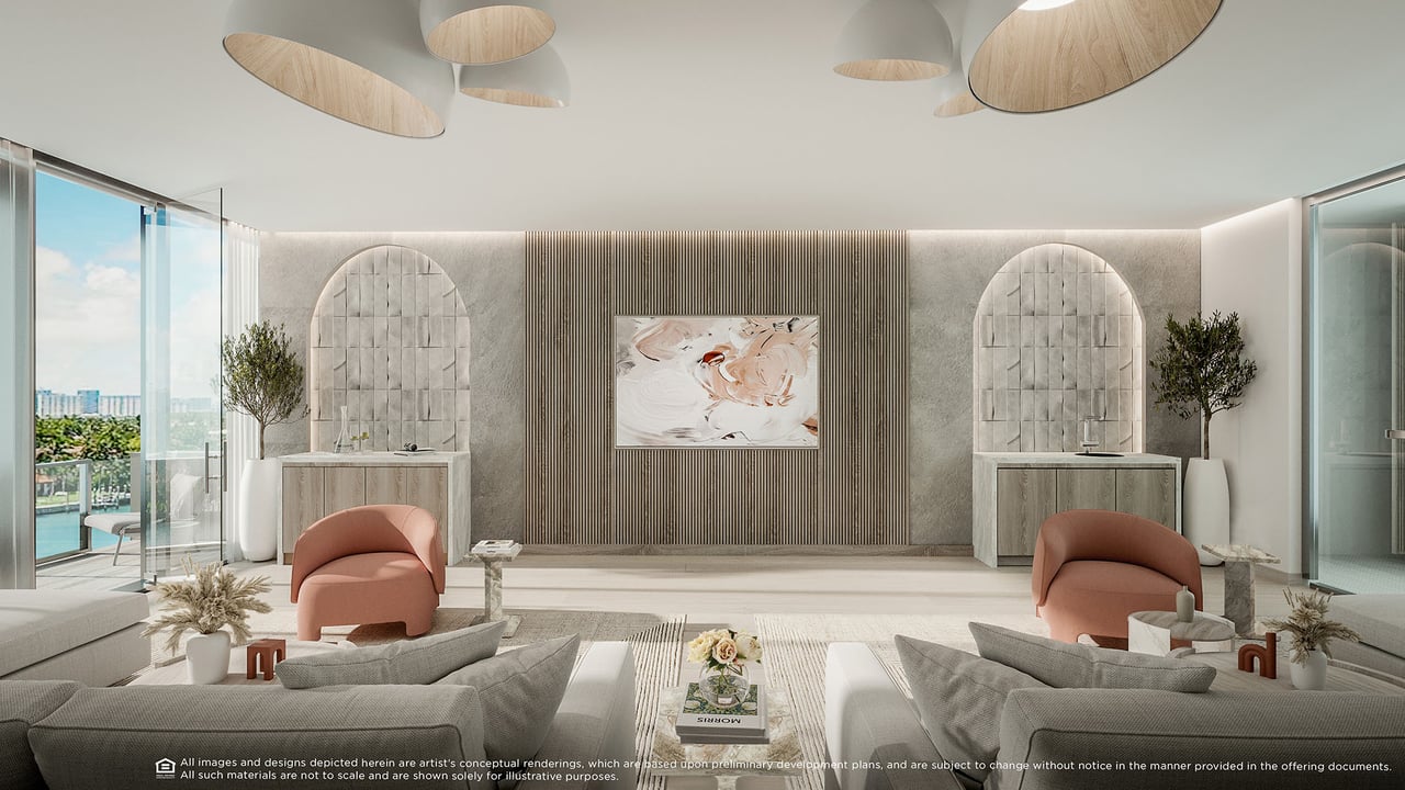 Furnished condo living room with arched wall niches, blush chairs, and floor-to-ceiling windows overlooking the water.
