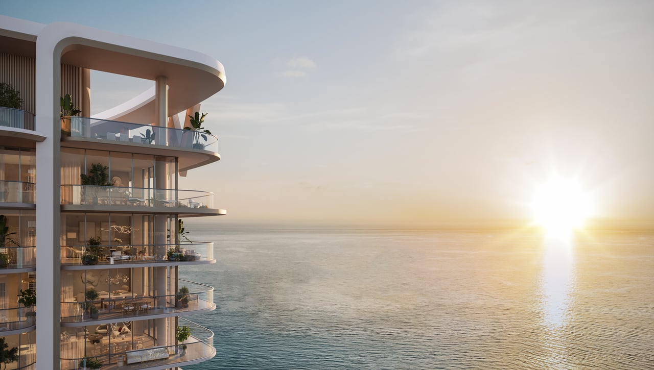 W Hotel & Residence Pompano Beach tower overlooking the ocean at sunset, with curved glass balconies.