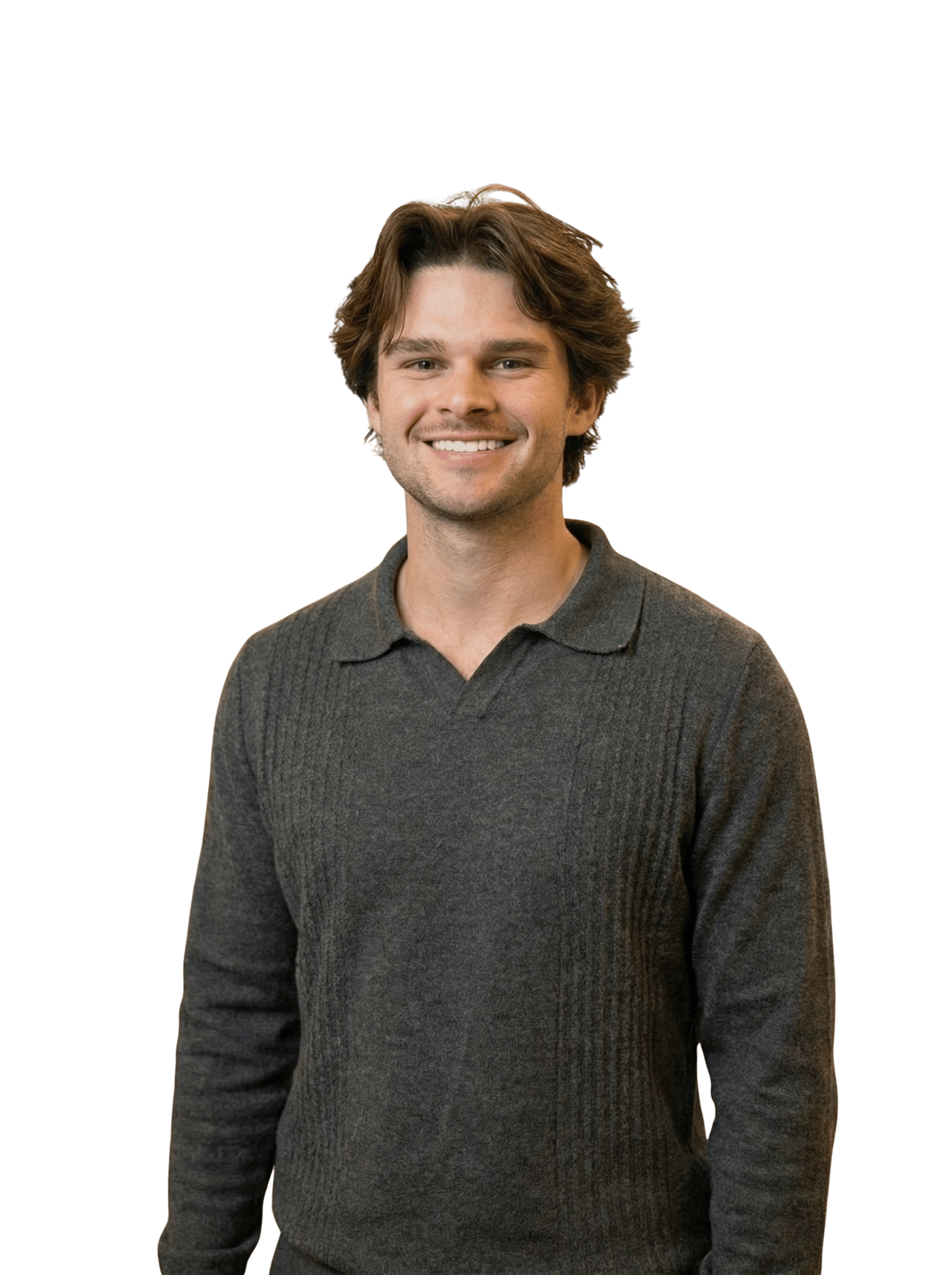 Tyler Weaver smiling in a charcoal gray knit polo.