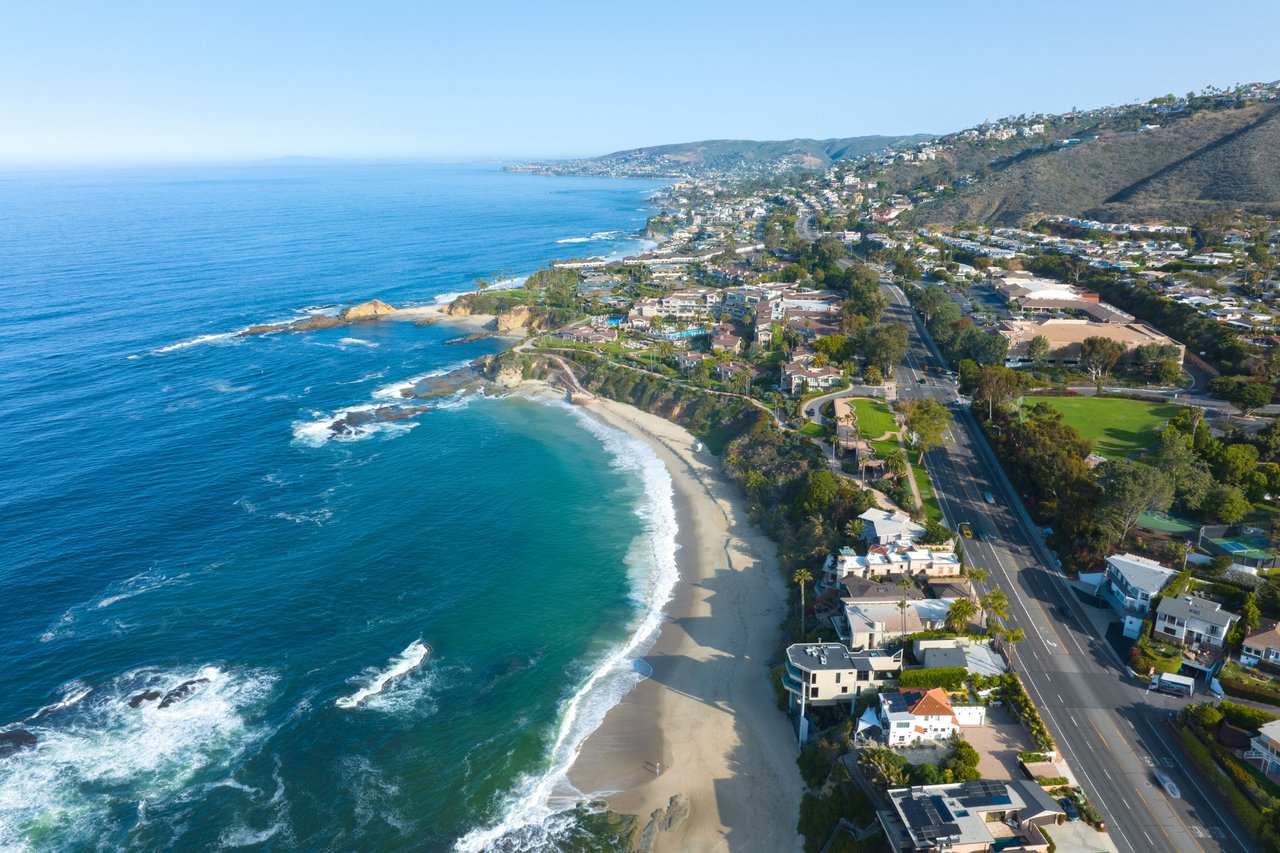 Aerial view of luxury coastal homes along Laguna Beach cliffs overlooking the Pacific Ocean