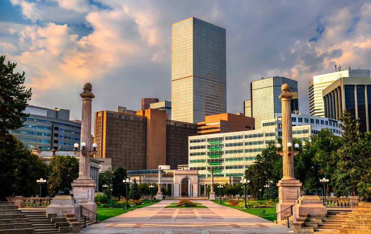 Denver skyline at sunset with cultural landmarks representing March 2026 Denver Free Days including museums, gardens, and historic sites.