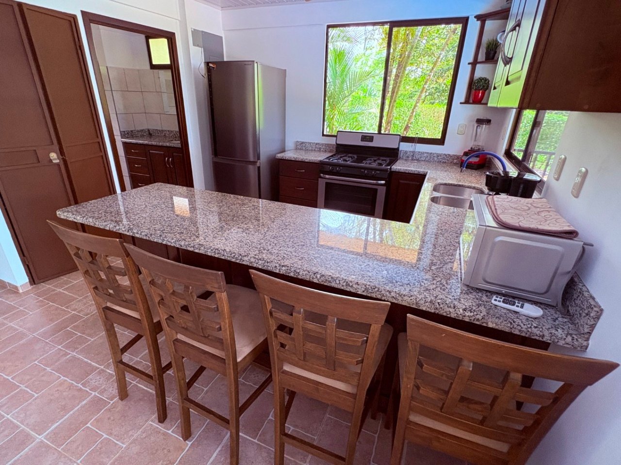Move in ready 2 bedroom / 2 bathroom home with window ocean view and pool in Ojochal.