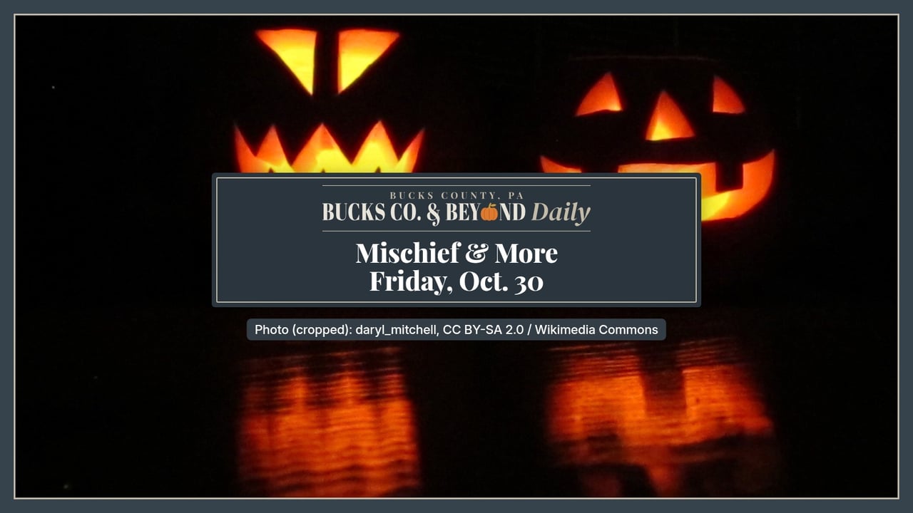 Two carved jack-o'-lanterns with glowing triangle eyes and jagged grins sit in the dark, their light reflected on the surface below.
