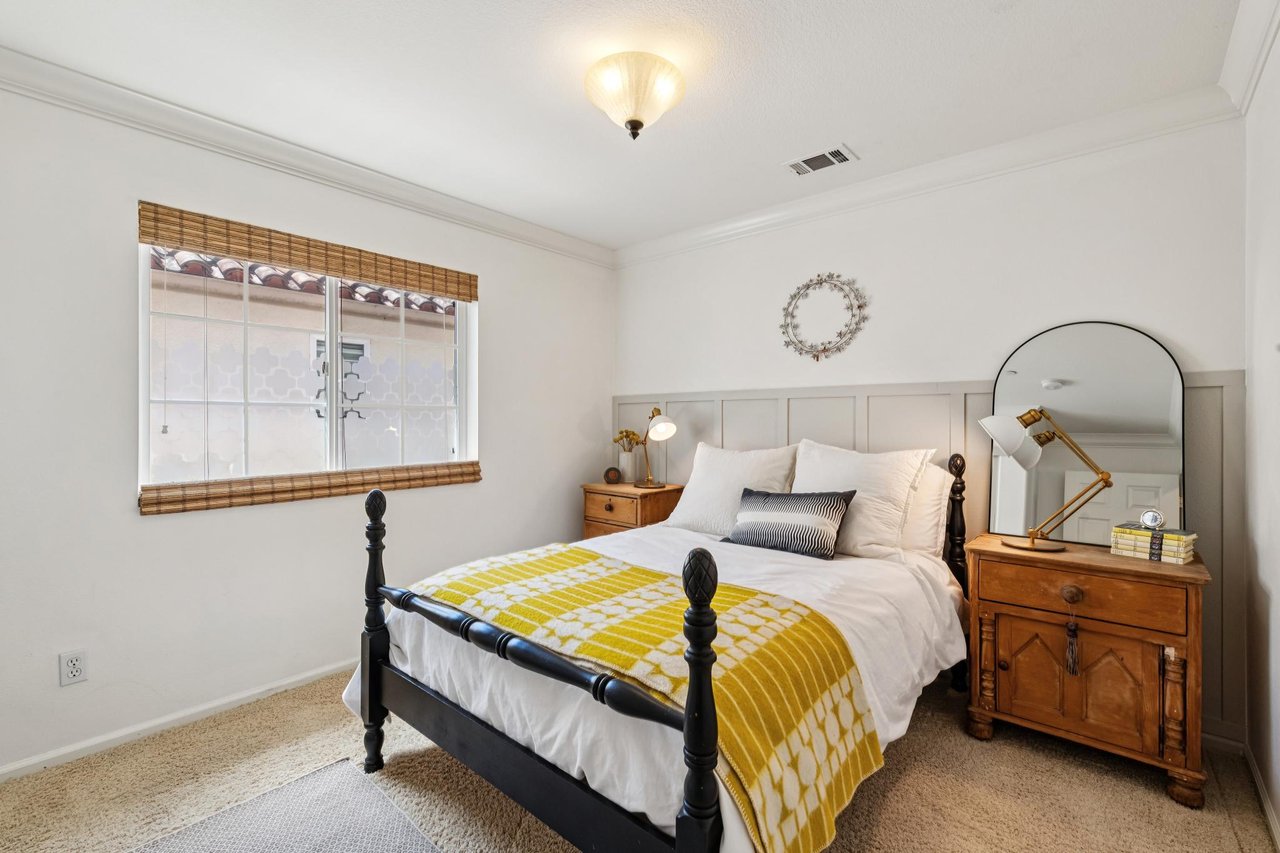 Elegant owner's suite offering private balcony access and a relaxing retreat atmosphere.