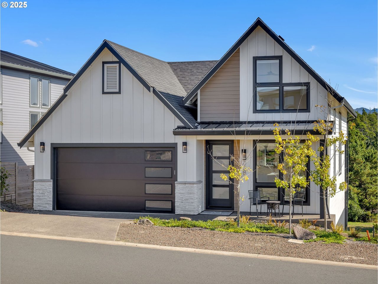 Sold modern Highlands home at 558 Sea View Dr in Manzanita, Oregon, with mountain and wooded views, buyer represented by Shelley Parker of Home + Sea Realty.