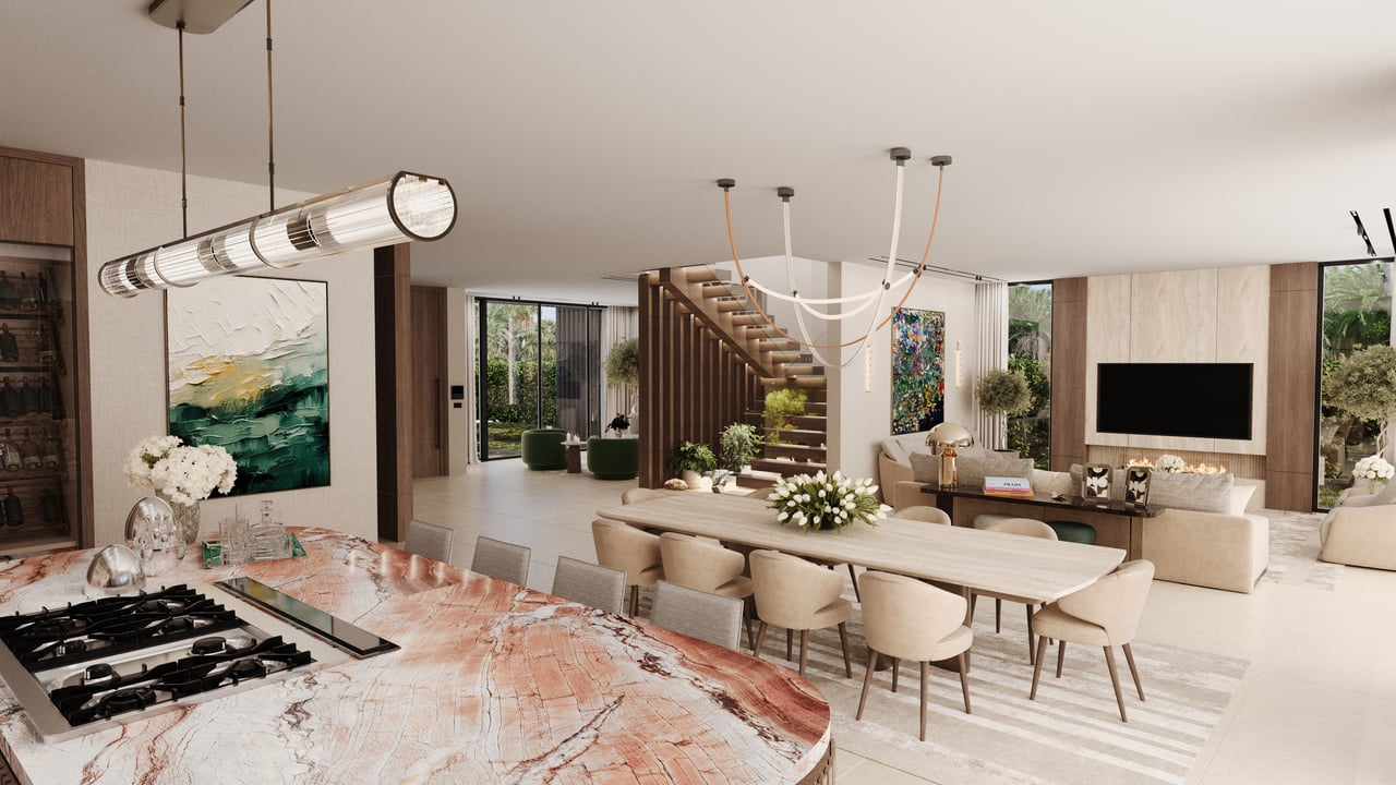 Open-plan kitchen and living area with a veined stone island and floating staircase.