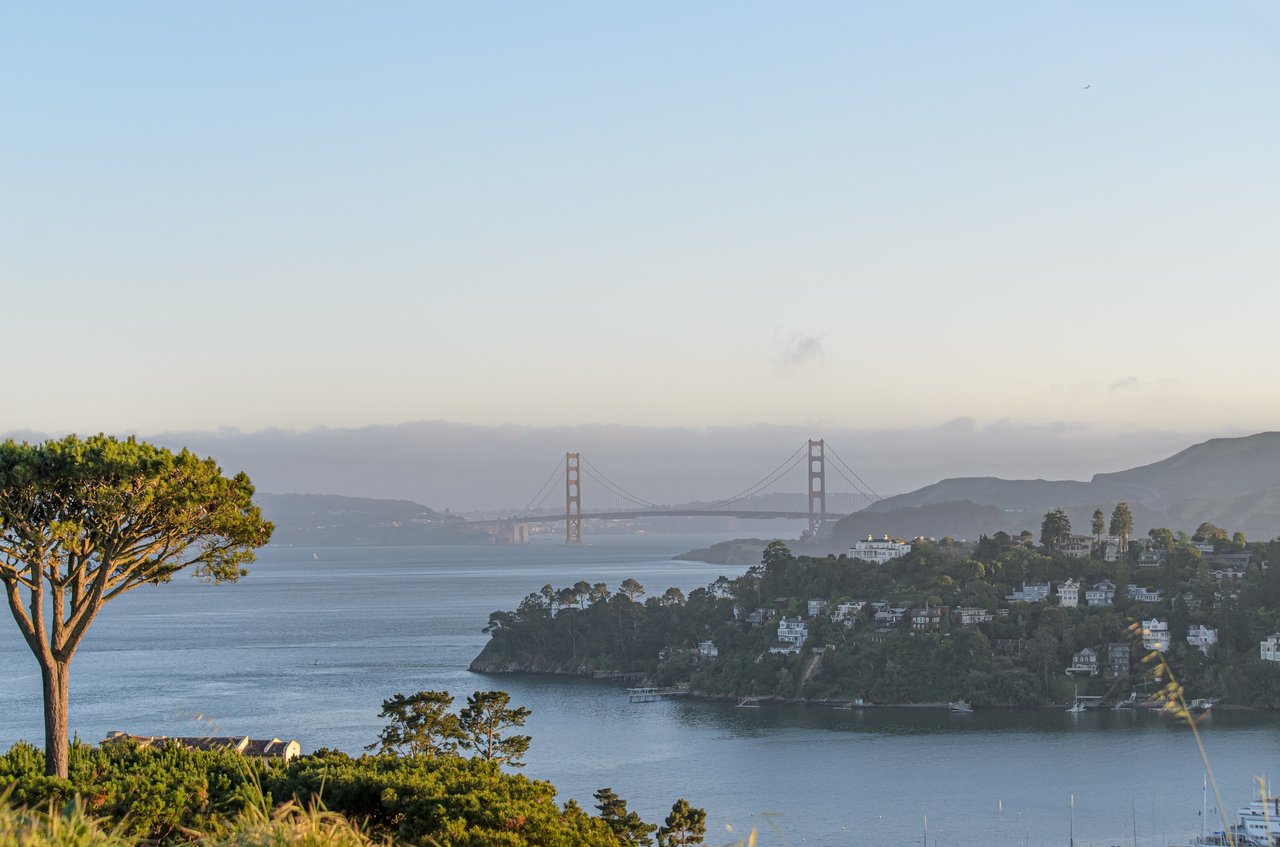 Real estate agent reviewing commission agreement with homebuyers in San Francisco