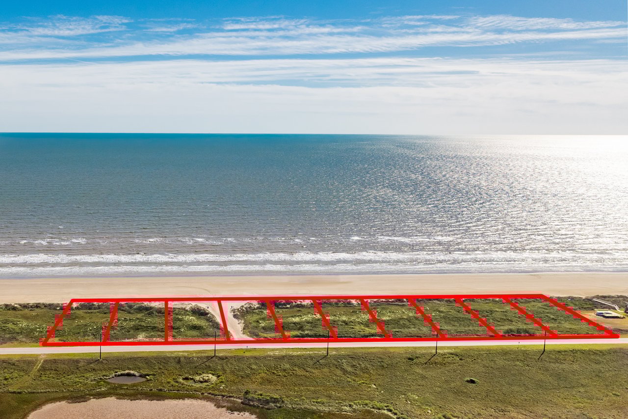 Aerial view of 9 large beachfront lots at Seaside Estates near Surfside Beach, TX — available Texas beachfront properties with panoramic blue Gulf views and private access.