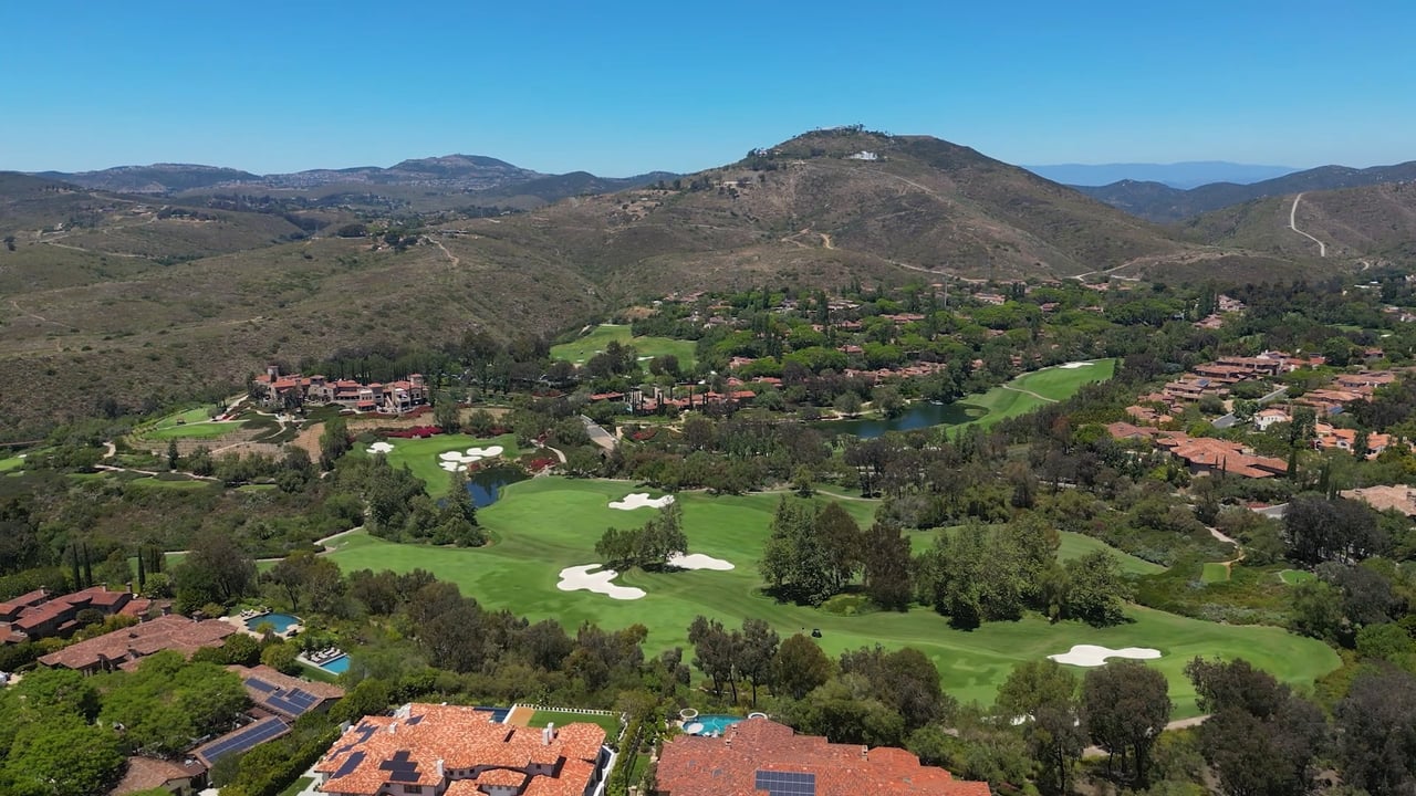 Aerial view of golf course and hillside community