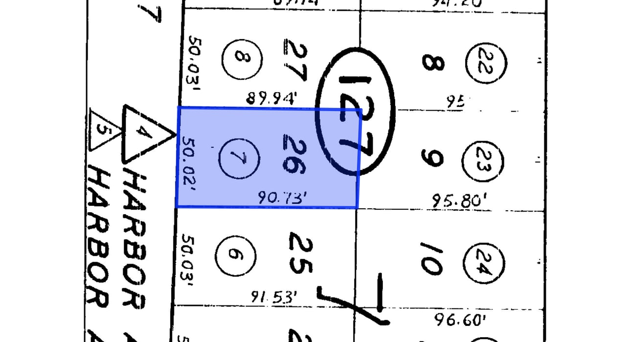 Parcel map highlighting lot 26 in blue, with neighboring lots and dimensions.