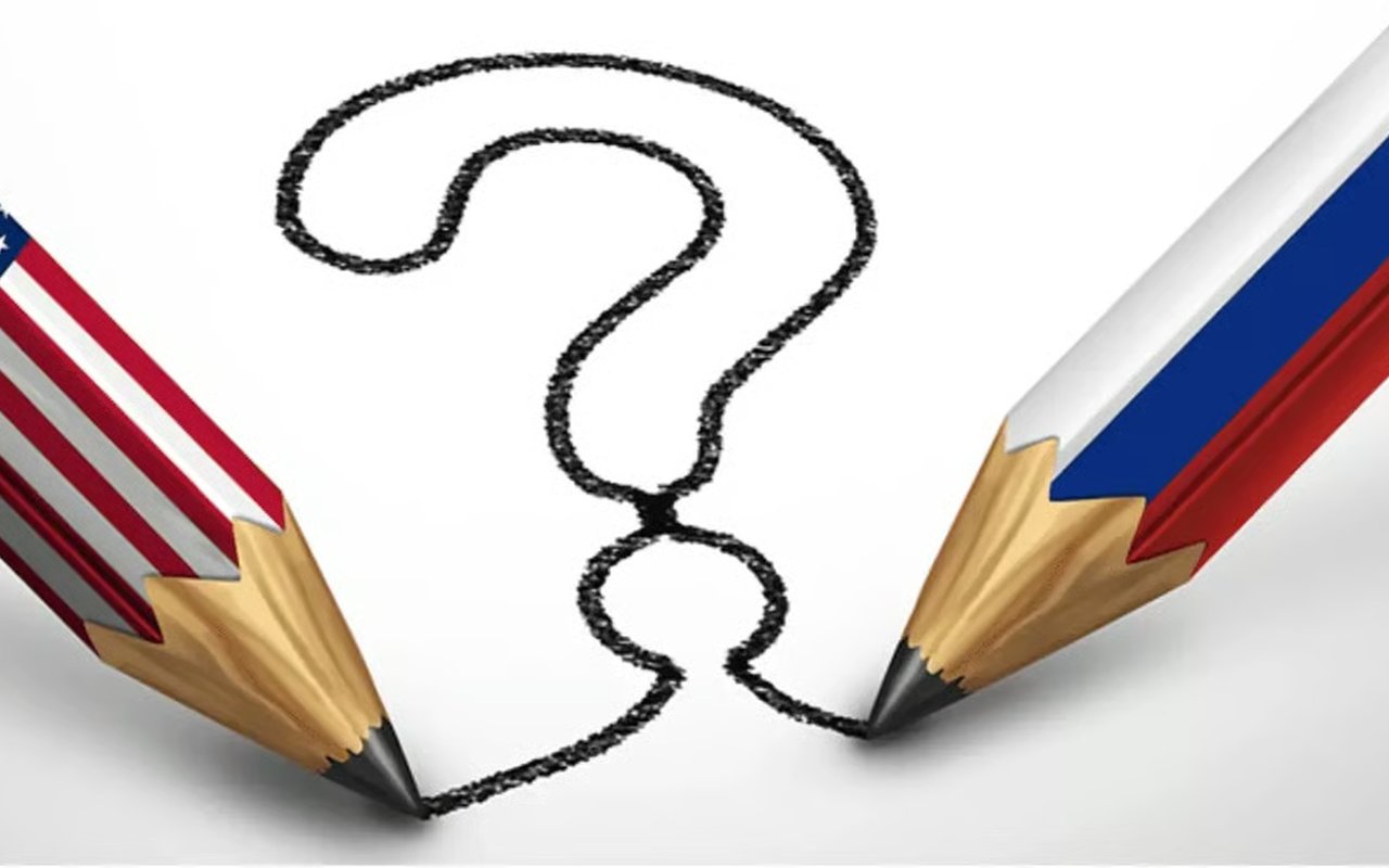 Question mark drawn between pencils patterned with US and Russian flag colors.