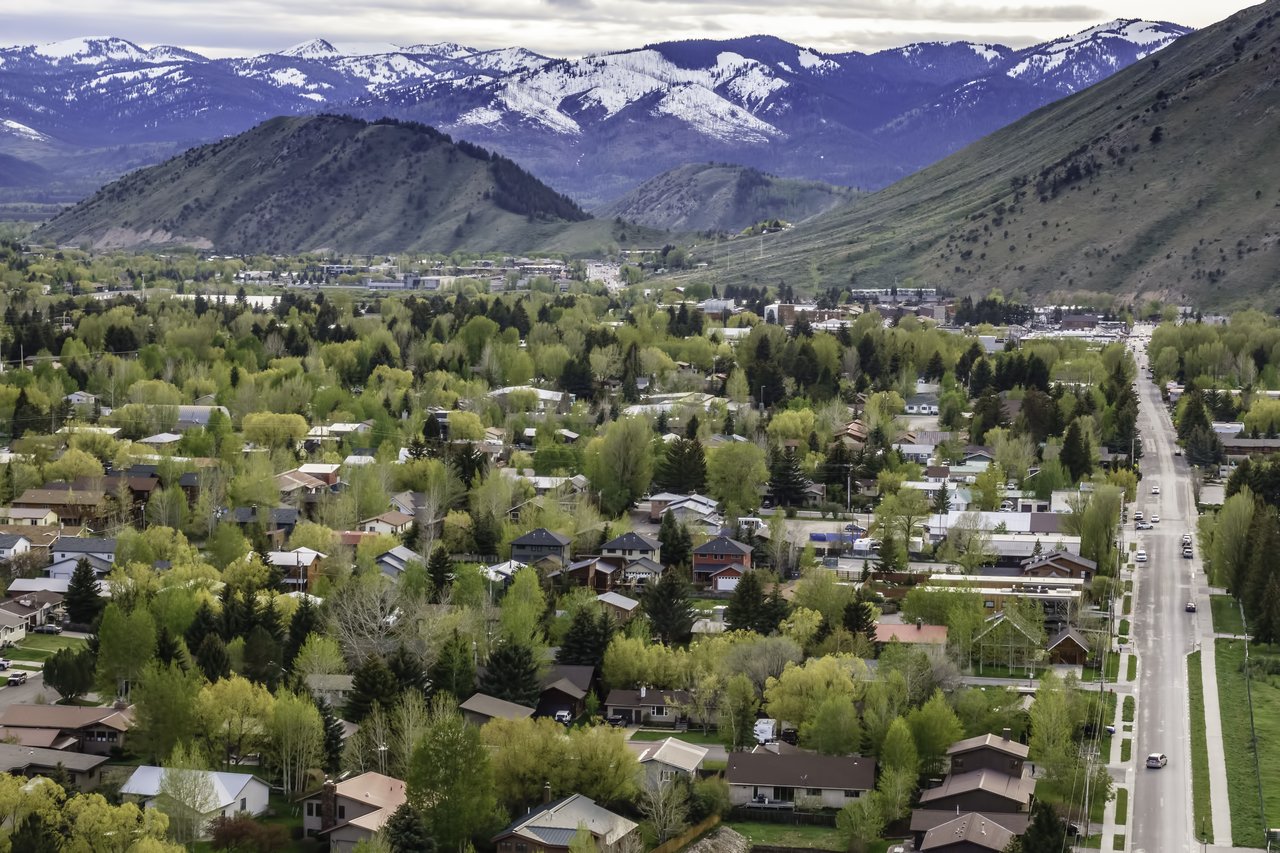 Scenic view of Jackson Hole homes for sale in a mountainous landscape, showcasing the ideal location for real estate investment in Wyoming.